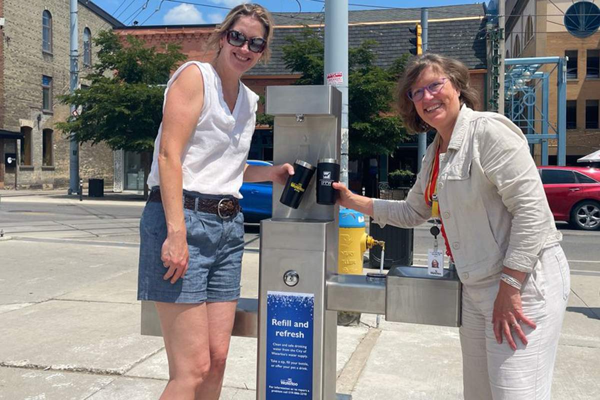 Waterloo Mayor Dorothy McCabe (right) helps launch the new fountain in Waterloo Public Square.