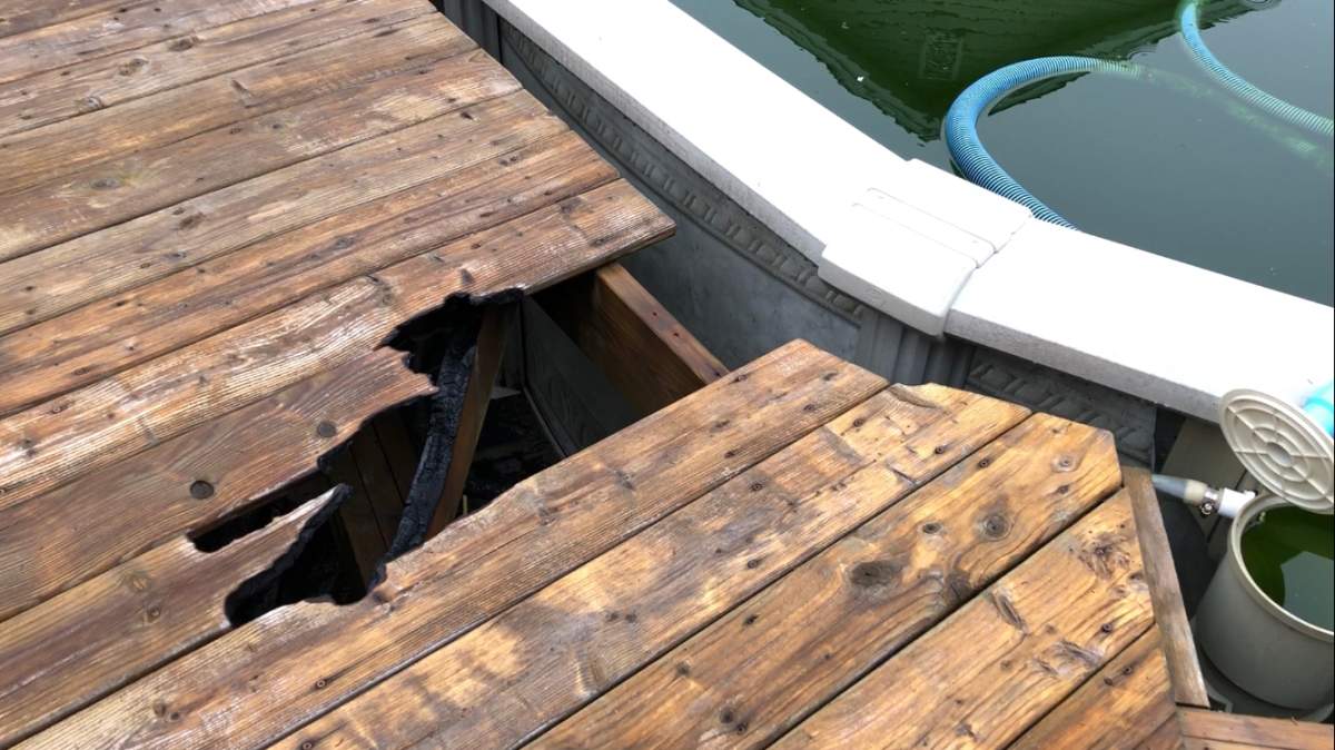 John Engram worries about the wildfire damage caused to his property in Hammonds Plains, including to his pool deck.