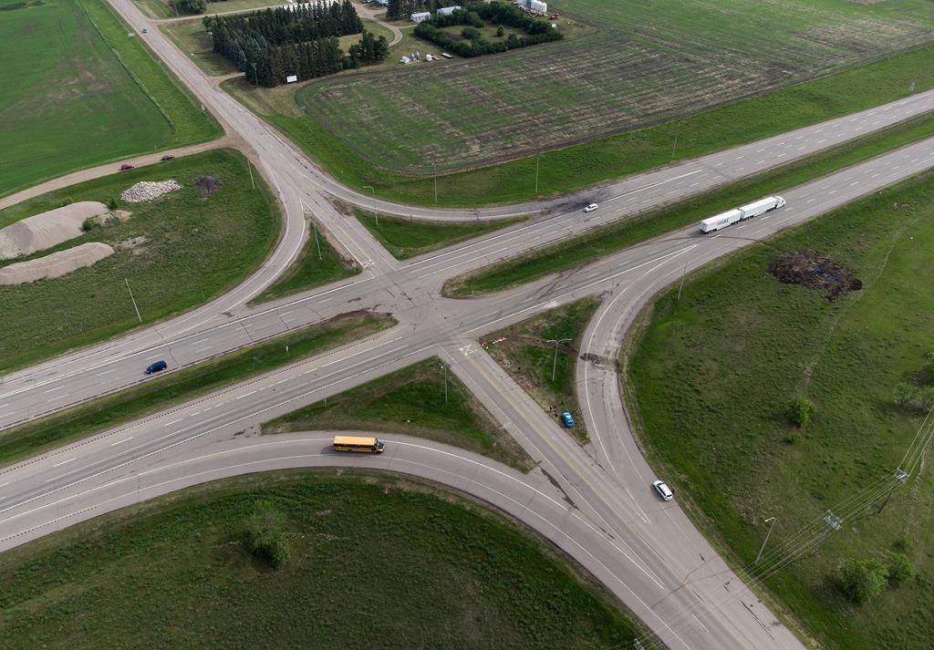 A scorched patch of ground where a bus carrying seniors ended up after colliding with a transport truck and burning is seen on the edge of the Trans-Canada Highway where it intersects with Highway 5, west of Winnipeg near Carberry, Man., Friday, June 16, 2023.