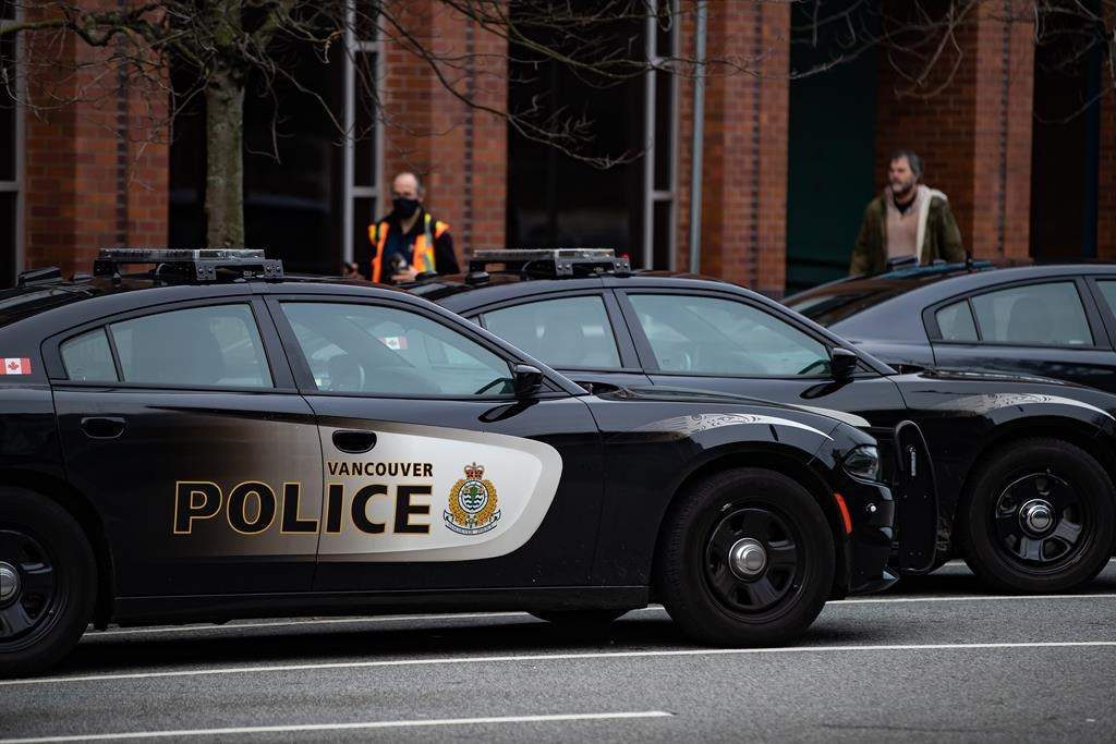 Police cars are seen parked outside Vancouver Police Department headquarters in Vancouver on Sat. Jan. 9, 2021.