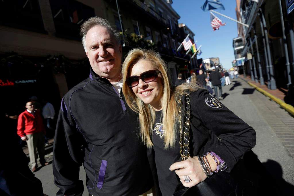 Sean and Leigh Anne Tuohy stand on a street in New Orleans, Feb. 1, 2013.