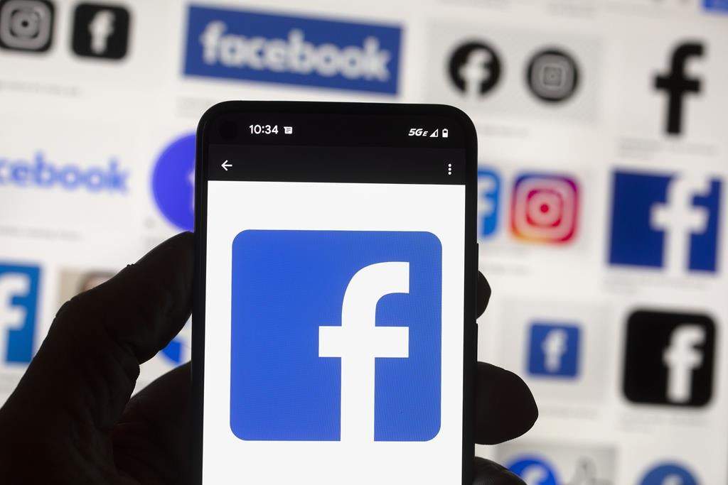 FILE - The Facebook logo is seen on a cellphone, on Oct. 14, 2022, in Boston.