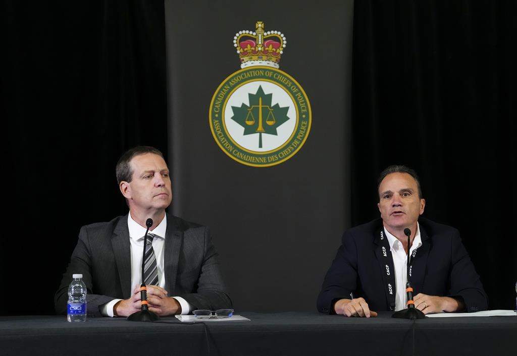 Ottawa Police Service Chief Eric Stubbs, left and Chief Danny Smyth, president of the Canadian Association of Chiefs of Police, hold a press conference during the CACP Summit in Ottawa on Tuesday, Aug. 22, 2023.