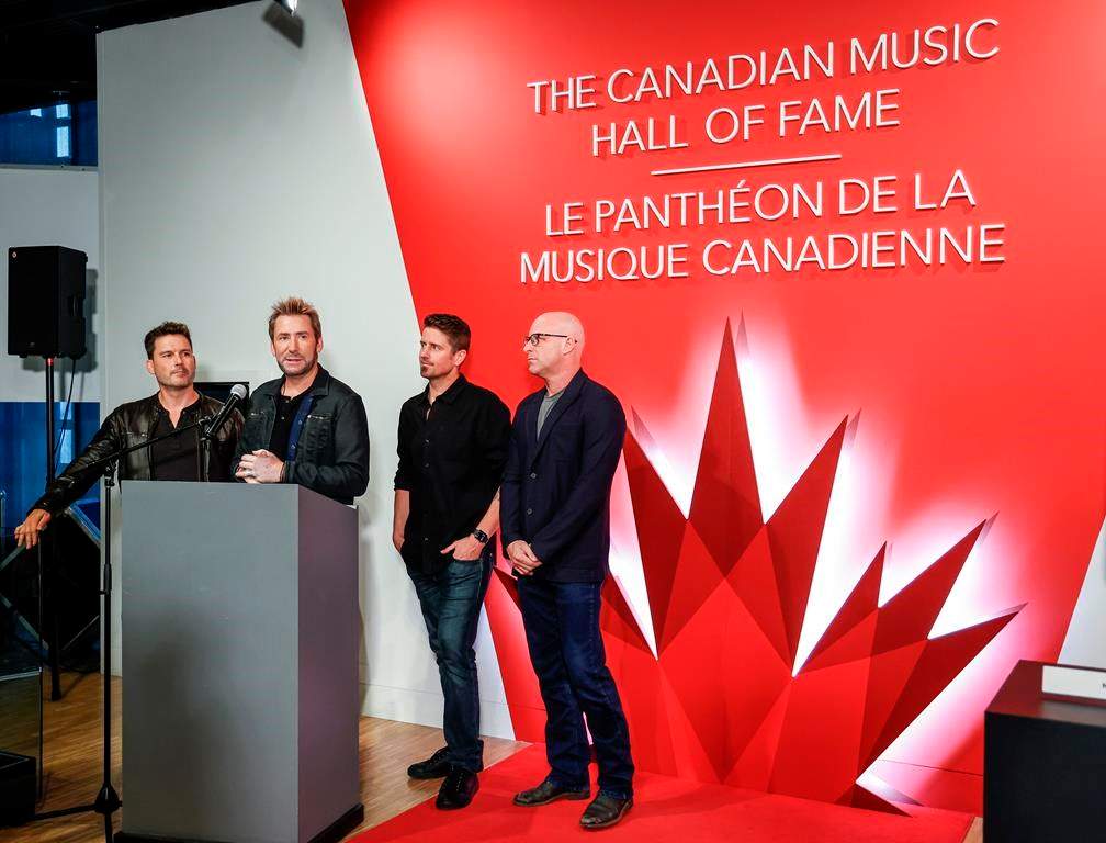 Members of the band Nickelback, consisting of, left to right, Ryan Peake, Chad Kroeger, Daniel Adair and Mike Kroeger attend a Canadian Music Hall of Fame plaque ceremony in Calgary on Sunday, June 25, 2023. Canadian rockers Nickelback, South African rapper Sho Madjozi and Finn Wolfhard’s band The Aubreys are among the artists set to perform at the Toronto International Film Festival’s annual street party. THE CANADIAN PRESS/Jeff McIntosh.