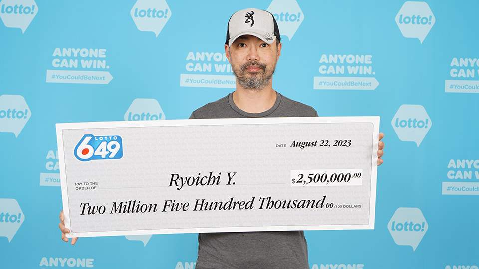 Ryoichi Yamada of North Vancouver with his lottery cheque worth $2.5 million.
