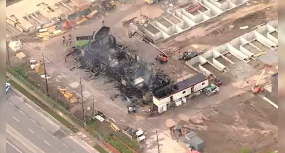 A helicopter photo showing a row of townhomes under construction in Burlington, Ont. destroyed by fire on Aug. 2, 2022.