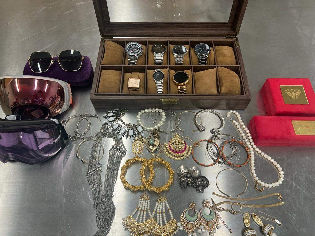 Cochrane RCMP are releasing this photo of several items seized from the accused in hopes that a potential victim may identify these items.