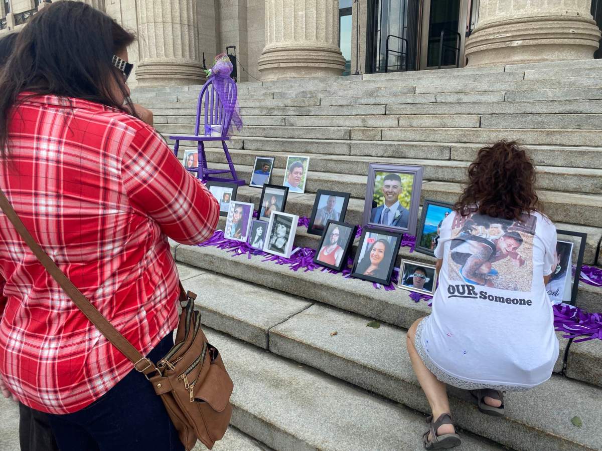 Memorial photos and ribbons are placed on the steps at the Manitoba Legislature Thursday.