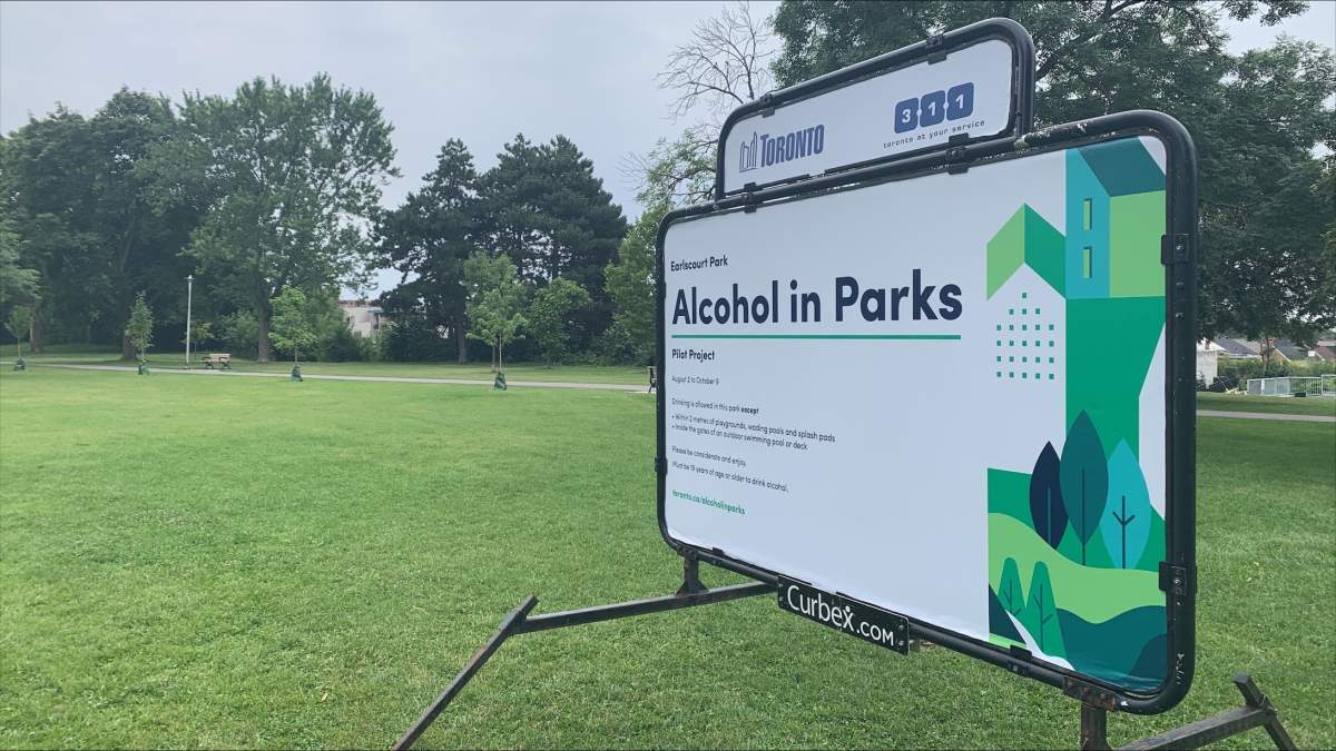Signs for consuming alcohol in public parks in Toronto on Aug. 2, 2023