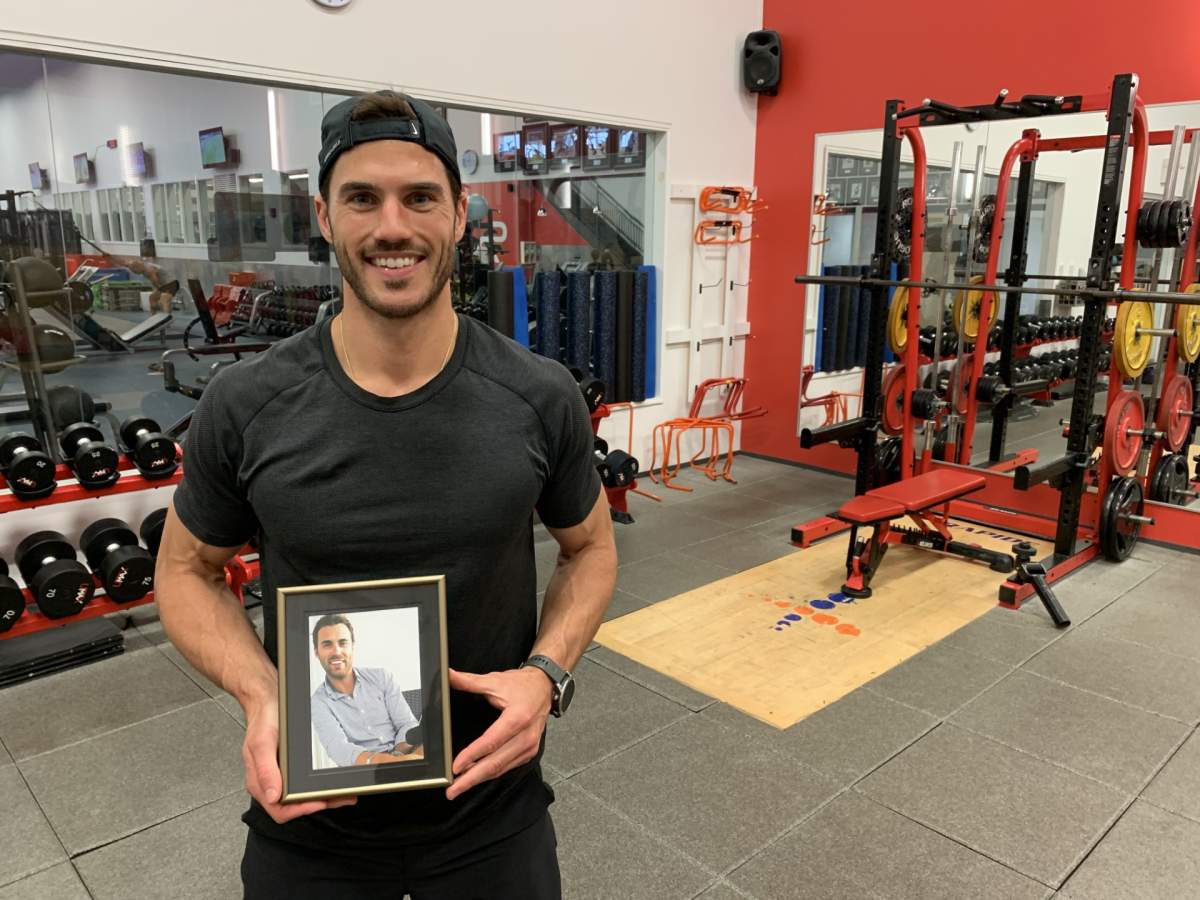 Samuel Finn holds a picture of his older brother, Cedric. Thursday August 3rd, 2023.