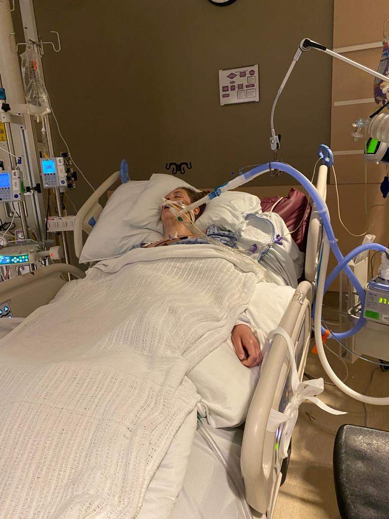 Woman in hospital bed.