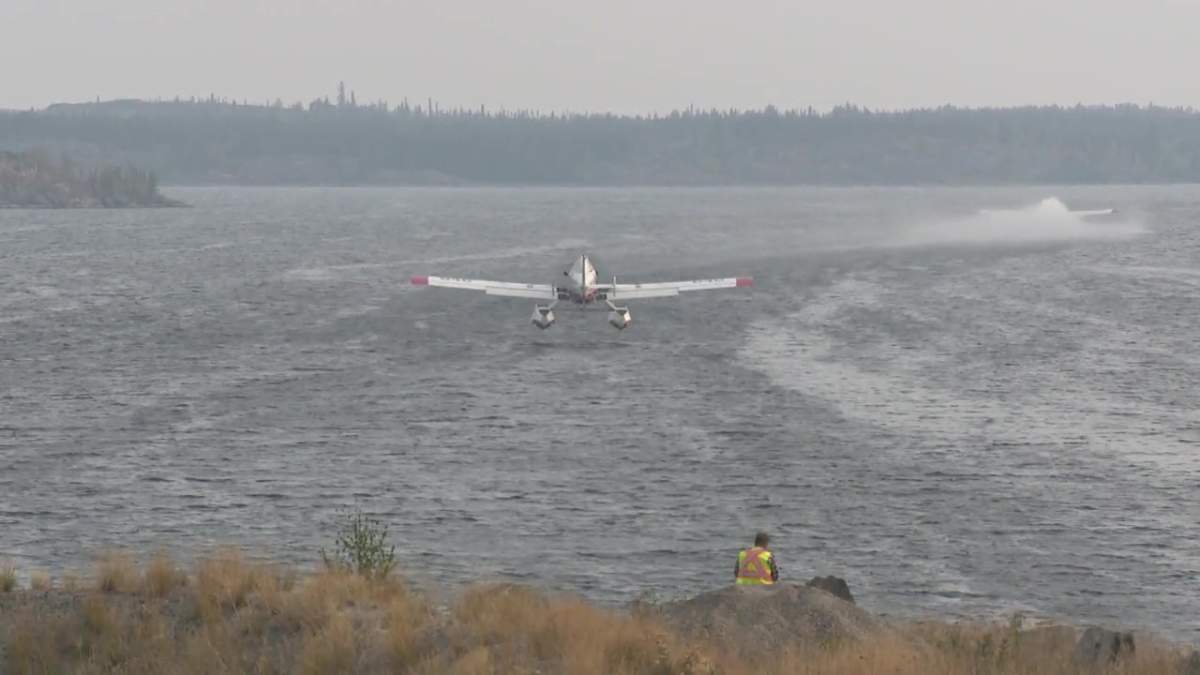 A wildfire water bomber picking up water from Great Slave Lake near Yellowknife, N.W.T. on Wednesday, Aug. 16, 2023.