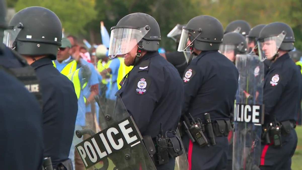 A heavy Edmonton Police Service presence breaking up a fight between anti-Eritrea protesters and Eritrean Festival organizers at an event in north Edmonton on Saturday, August 19, 2023.