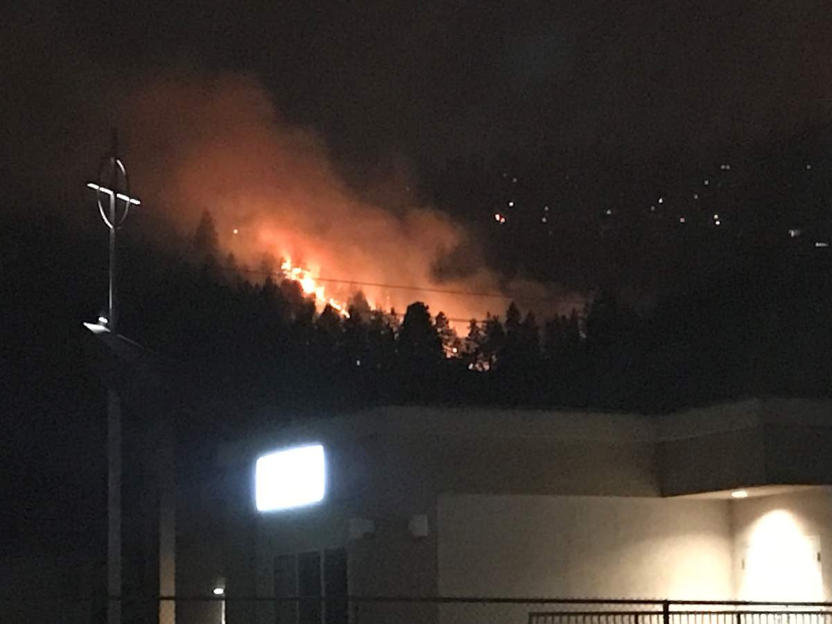 A photo of a wildfire taken from Glenmore Road in Kelowna, B.C., just before midnight on Friday, Aug. 18, 2023.