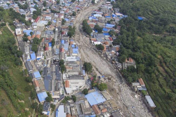An aerial view of the flood devastated Nanxinfang village on the outskirts of Beijing, Friday, Aug. 4, 2023.