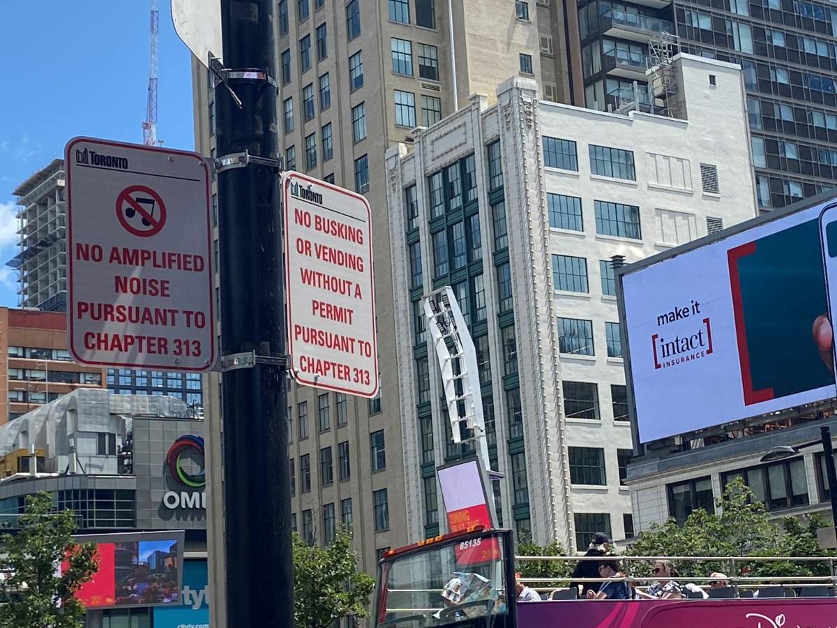 Complaints from businesses prompted the city to erect signs detailing Toronto bylaws for busking and amplification.