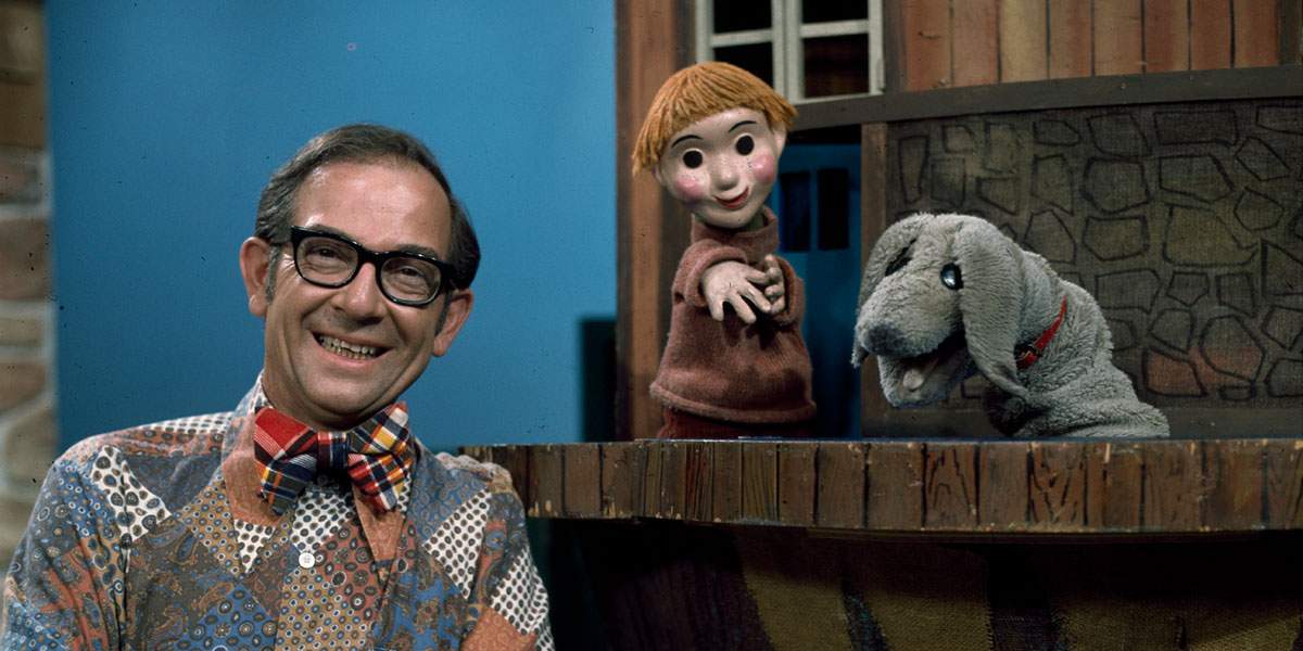 Mr. Dressup and some puppets.