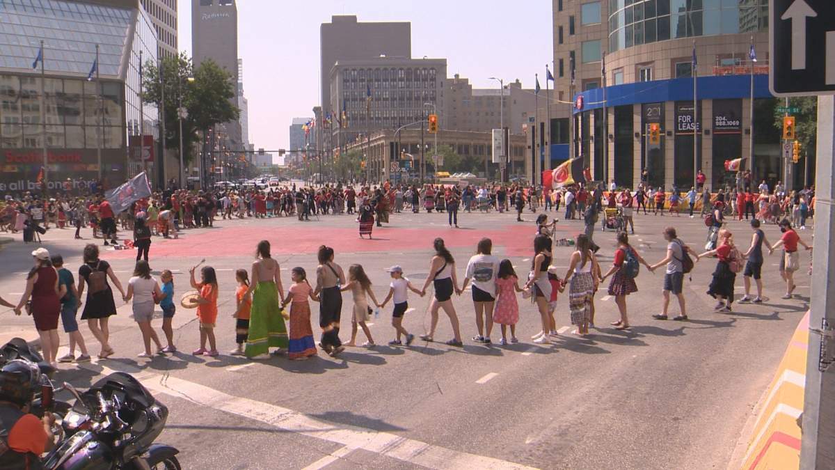 A round dance is held at Portage and Main on Thursday, August 3, 2023.