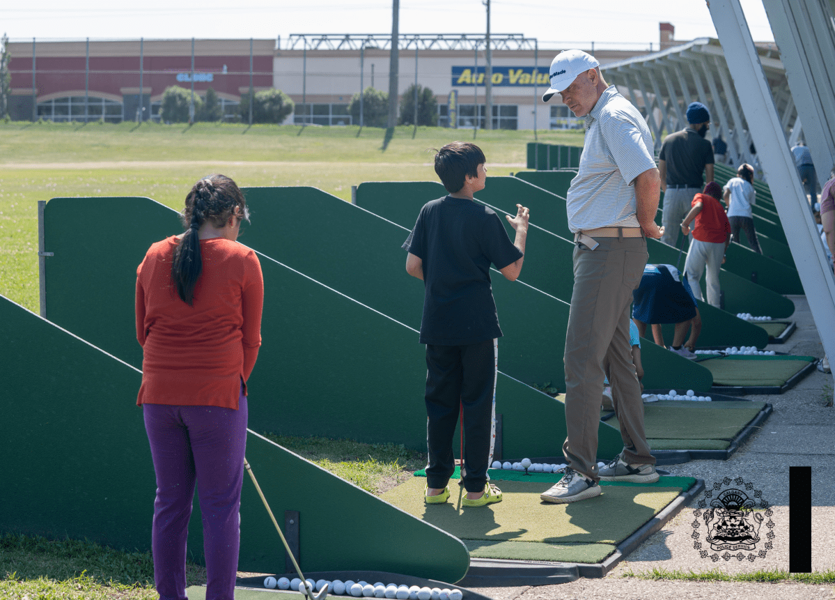 Golfing lesson at Operation Tee-Time in Calgary.