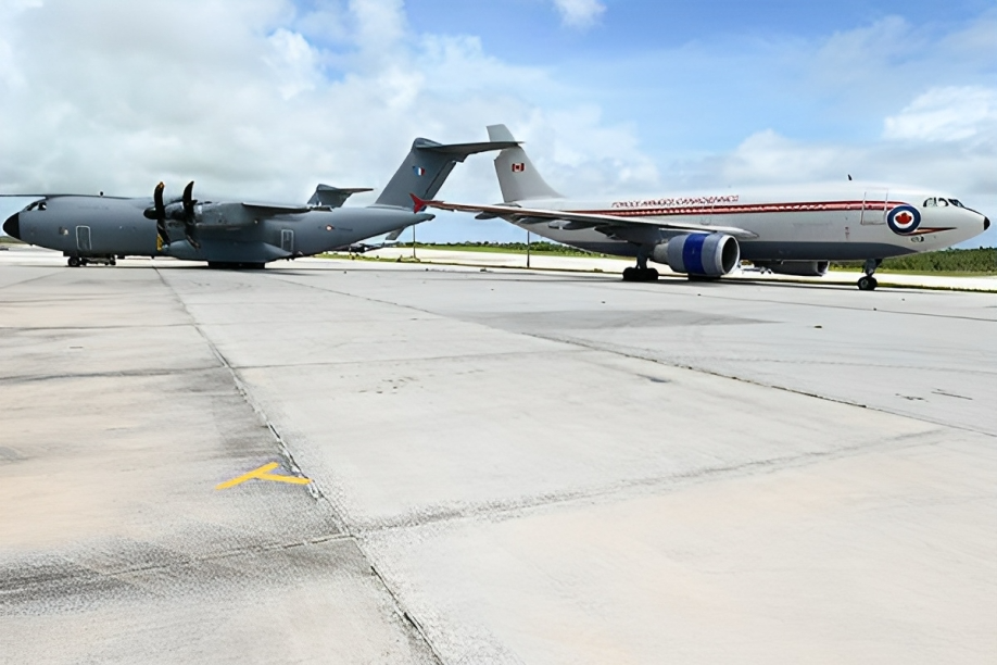 This image provided by the Department of National Defence shows the aftermath of a collision between a Royal Canadian Air Force CC150 Polaris aircraft and a French Air Force A400M plane on the tarmac of a U.S. Air Force base in Guam on July 21, 2023.