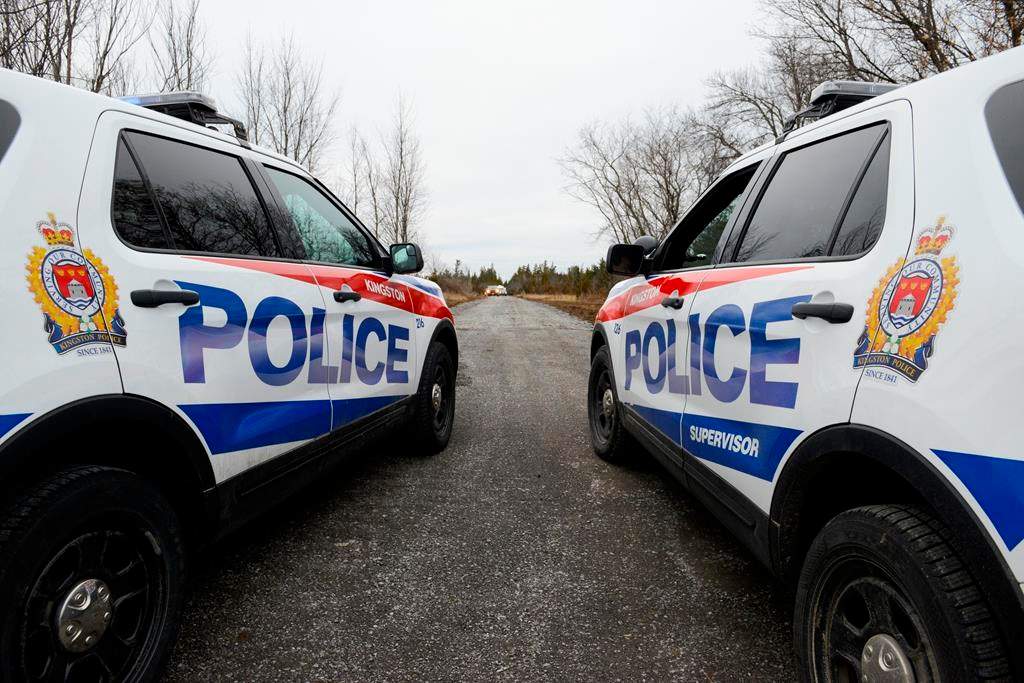 Photo of two police cruisers.
