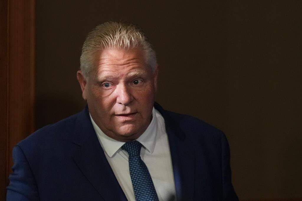 Ontario Premier Doug Ford enters a room to speak to journalists at the Queens Park Legislature in Toronto on Tuesday, Sept. 5, 2023. 