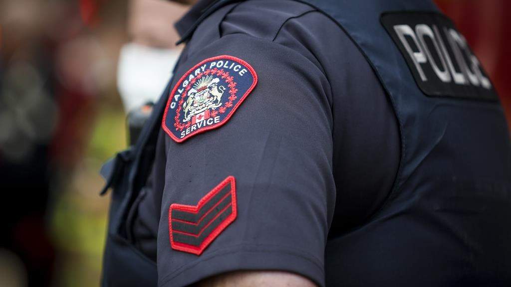 FILE - A Calgary Police Service officer. An off-duty officer’s badge was stolen last Sunday from a vehicle near Canmore, police said Tuesday. THE CANADIAN PRESS/Jeff McIntosh.