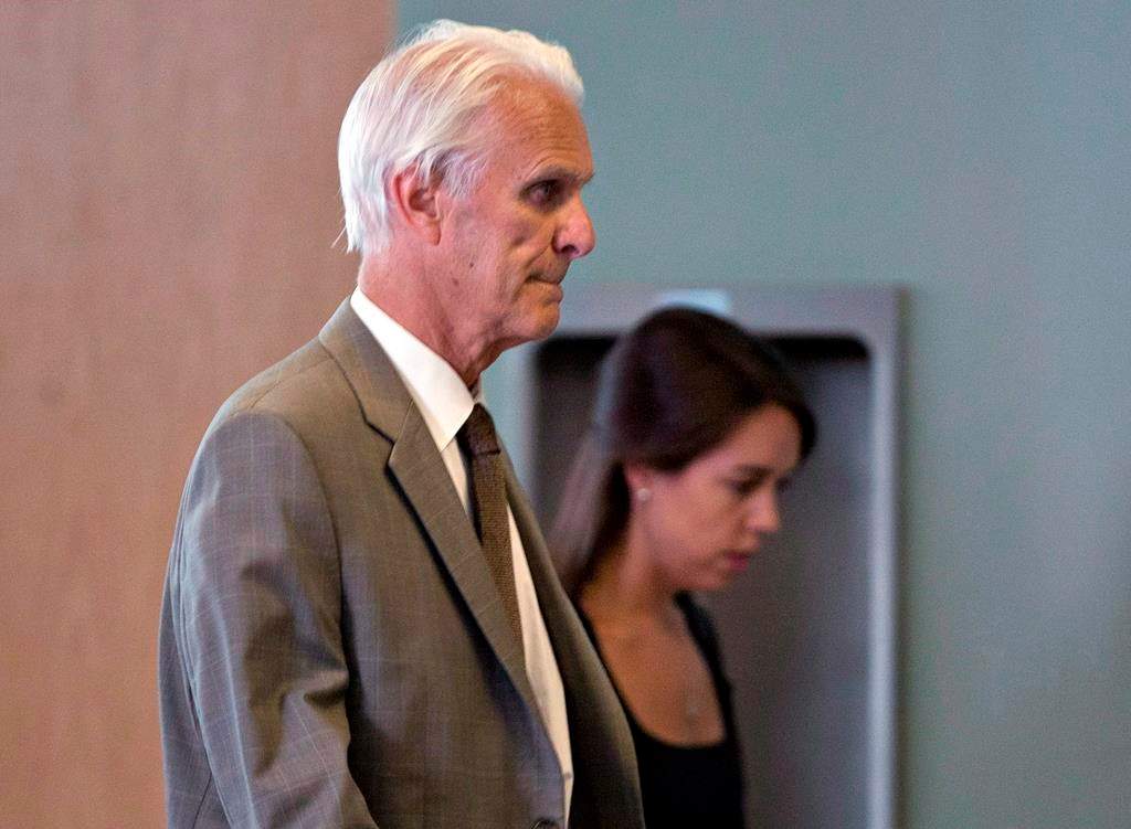 Quebec's Court of Appeal has overturned a stay of proceedings granted to retired Quebec judge Jacques Delisle, whose conviction for fatally shooting his wife in 2012 was reversed by the federal justice minister. Delisle, left, walks into court with his granddaughter Anne Sophie Morency, Thursday, June 14, 2012 in Quebec City. THE CANADIAN PRESS/Jacques Boissinot.