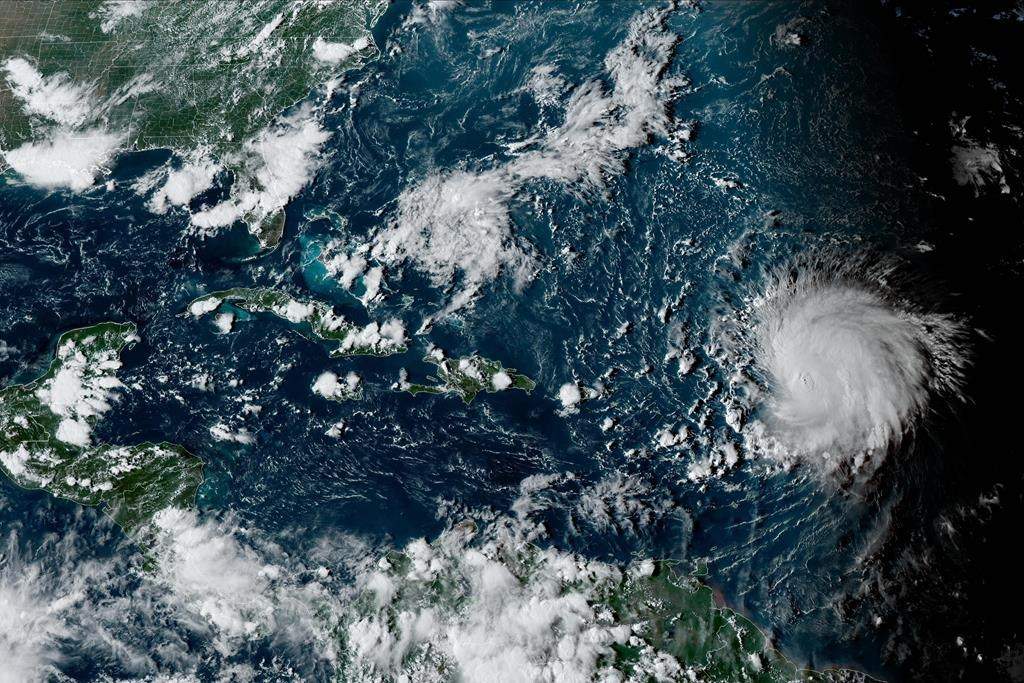 Canadians are likely to learn more about the track of hurricane Lee later this week, after it becomes clear where the storm will turn the corner to begin its journey northwards. This satellite image provided by the National Oceanographic and Atmospheric Administration shows Hurricane Lee, right, in the Atlantic Ocean on Friday, Sept. 8, 2023, at 4:50 p.m. EDT.  THE CANADIAN PRESS/AP-HO, NOAA, *MANDATORY CREDIT*.