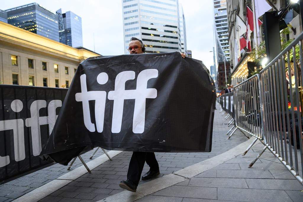 A boisterous world premiere of Talking Heads’ revamped classic “Stop Making Sense” brought a Toronto International Film Festival audience to its feet as moviegoers and the band themselves jumped up to dance, hoot and clap along to ‘80s hits. The red carpet of the TIFF Tribute Awards gala fundraiser is torn down by stagehands, during the Toronto International Film Festival, in Toronto, Sunday, Sept. 10, 2023.