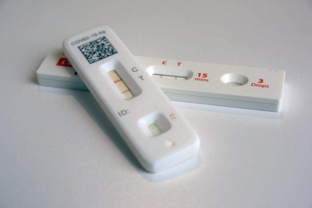 FILE - COVID-19 antigen home tests indicating a positive result are photographed in New York, April 5, 2023. The Alberta government launched its new respiratory virus data dashboard on Monday and promised it will be updated every Thursday during the respiratory virus season. (AP Photo/Patrick Sison, File).