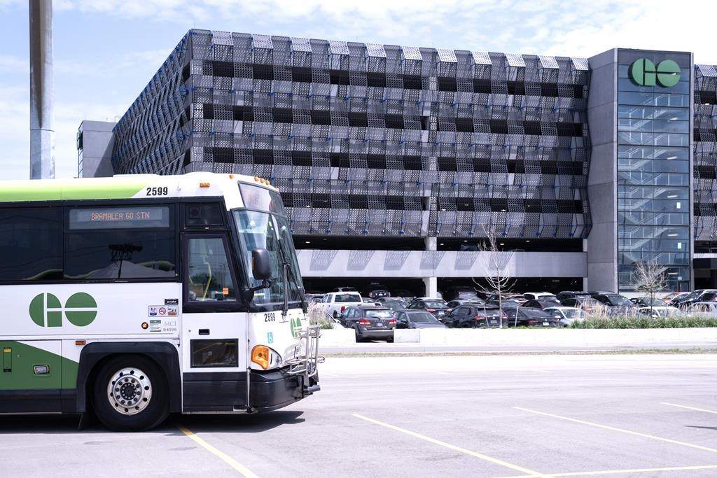 A bus is seen outside the parking lot at the Bramalea GO Station, in Brampton, on Thursday May 11, 2023. Ontario's minister of infrastructure is proposing a new way of funding GO Transit stations that she says will both increase transit service and housing nearby.