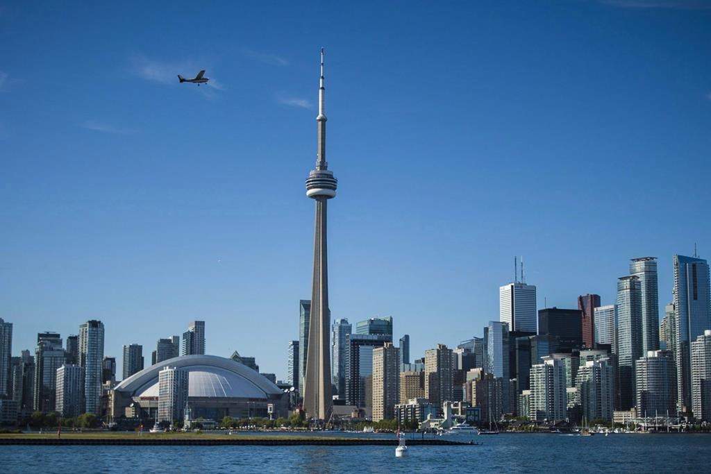 A home-sharing platform hopes to connect refugees in need of temporary housing with homeowners who have spare rooms to rent, in an effort to help ease the shelter crisis in Toronto. The Toronto skyline is photographed from the Hanlan's Point Ferry as it travels back to the city on Thursday, June 21, 2018. THE CANADIAN PRESS/Tijana Martin.