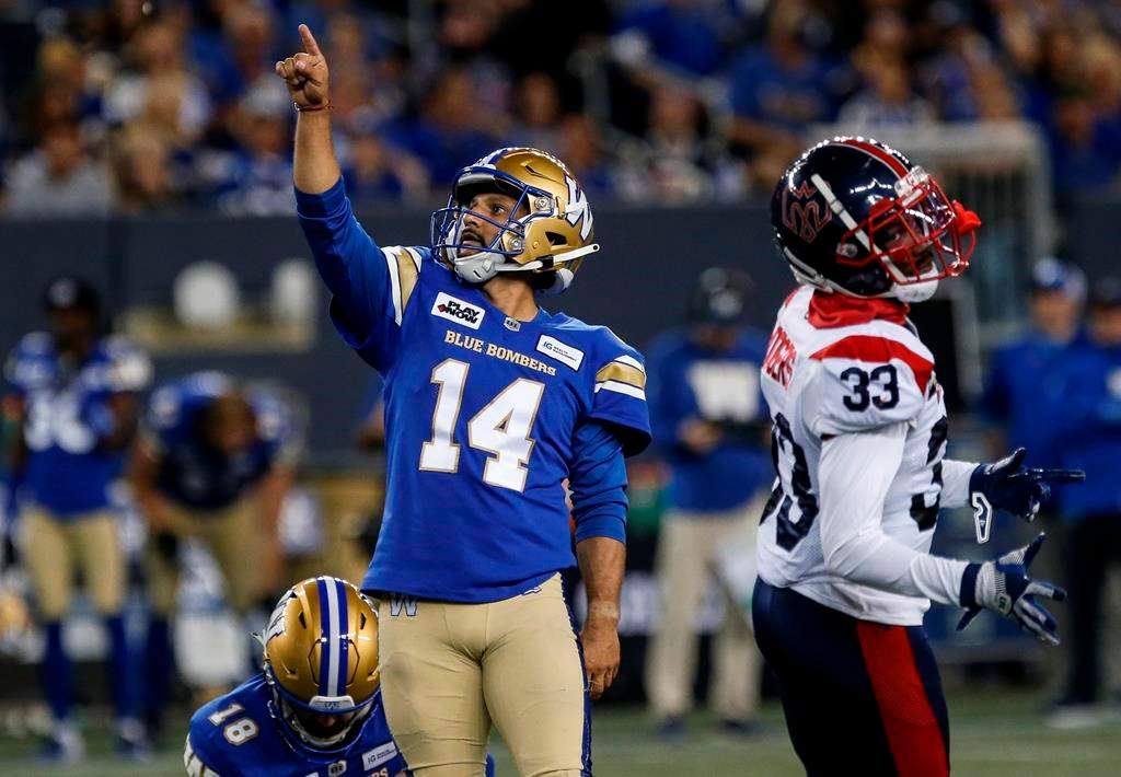 Blue Bombers placekicker Sergio Castillo is used to having football players run full blast at him while he concentrates on kicking balls. Castillo (14) makes the conversion kick against the Montreal Alouettes during second-half CFL action in Winnipeg on Aug. 24, 2023.