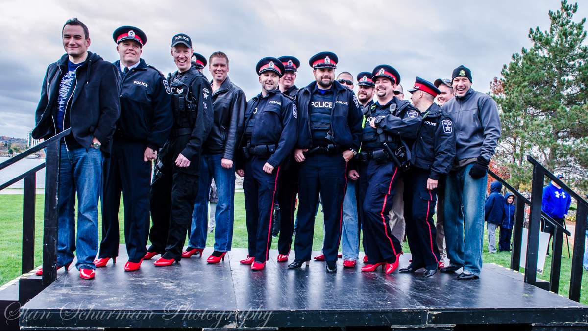 Barrie police participating in the Walk a Mile in Her Shoes event in Barrie, Ont.