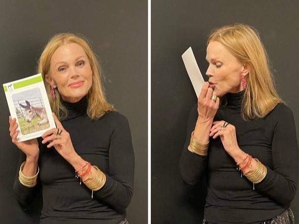 Go-Go's singer Belinda Carlisle with a photo of Duke the donkey.