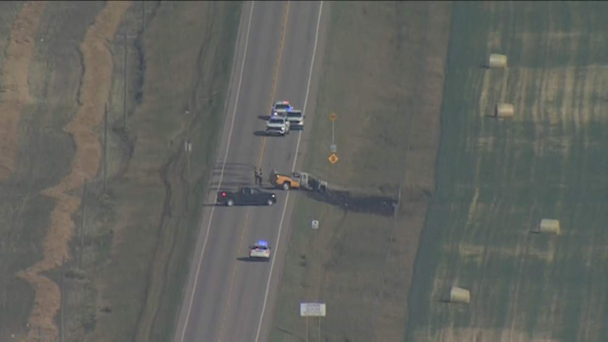 Emergency crews on the scene of a fatal Sept. 13 crash on Highway 566, north of Calgary city limits.