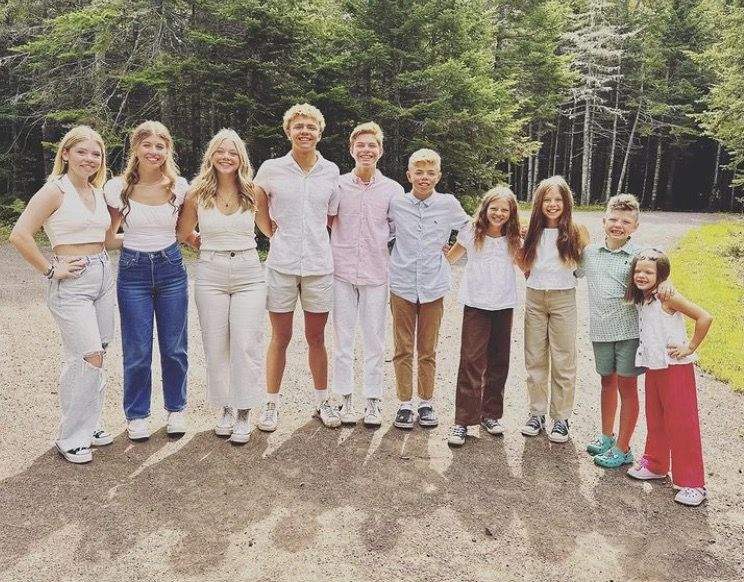 The couple and their 10 children, pictured here, have been unable to live in their home since post-tropical storm Fiona.