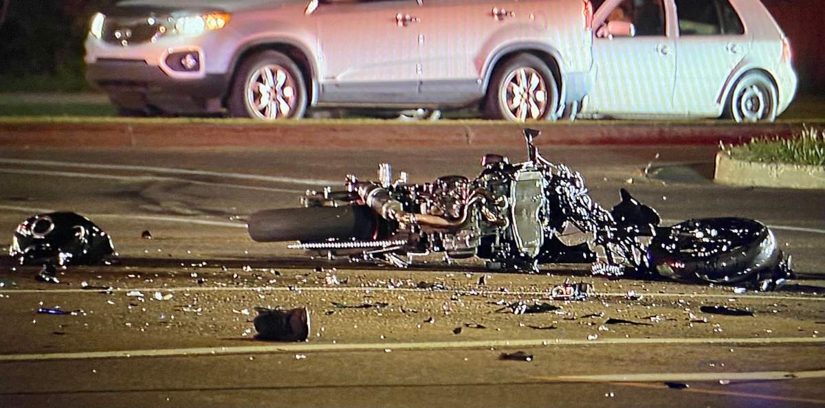 Edmonton police said the motorcycle struck a turning car with enough force to spin the vehicle 180 degrees. The driver of the car went to hospital as a precaution.