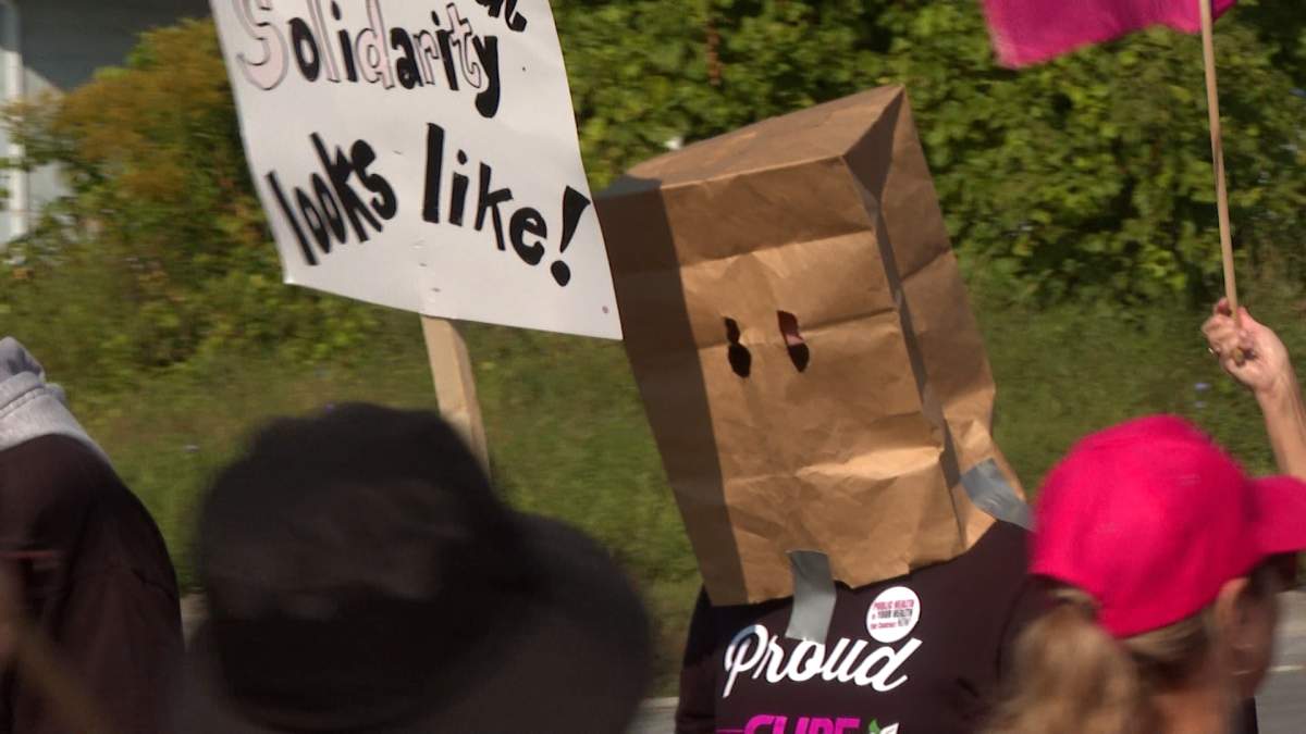 Health Unit employees strike outside the Belleville, Ont. office.