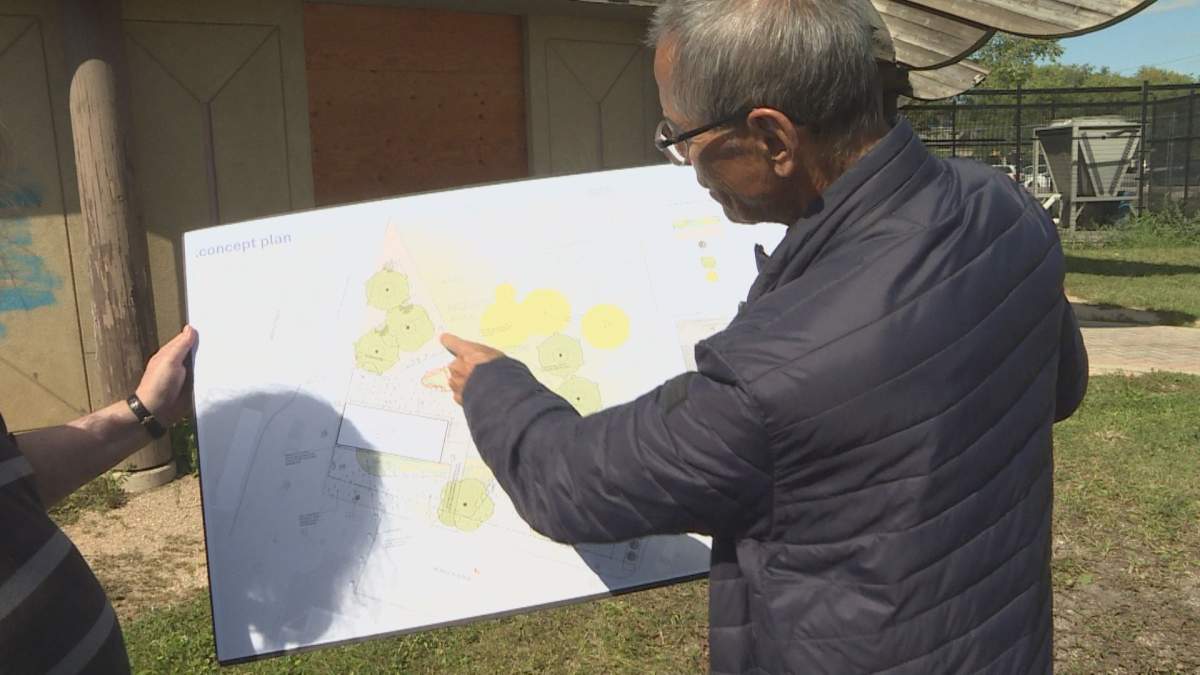 Damon Johnston looking at the concept plans for the Thunderbird House renovations.