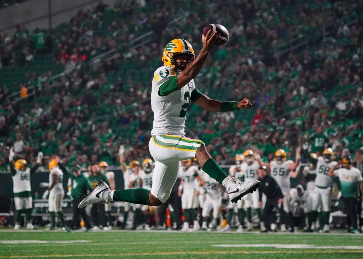 Elks quarterback Tre Ford celebrates a rushing touchdown in a road game against the Saskatchewan Roughriders.
