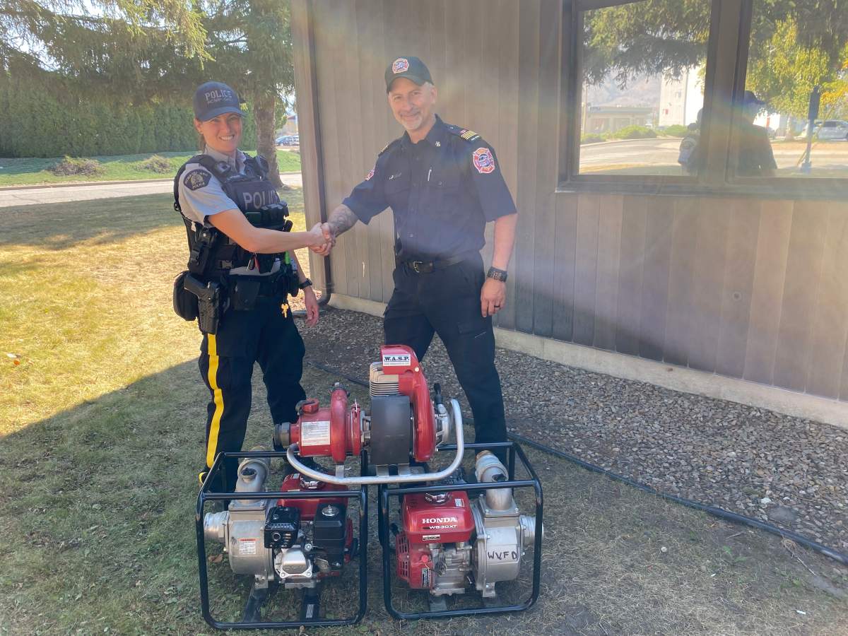 Oliver RCMP Const. Alexa Dubeau, who found the stolen equipment, and Willowbrook Volunteer Fire Department fire chief Tony Iannella.