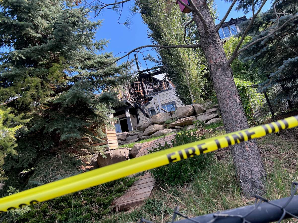 Calgary firefighters received multiple 911 calls reporting a house fire in the 100 block of Evansbrooke Way N.W. early Sunday and could see the flames from “some distance away” as they were en route to the blaze.