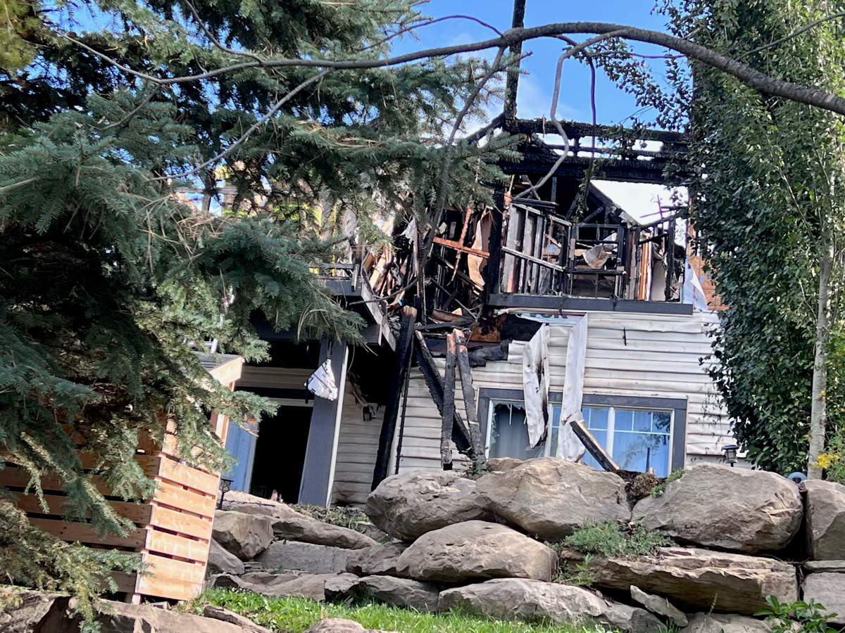Calgary firefighters received multiple 911 calls reporting a house fire in the 100 block of Evansbrooke Way N.W. early Sunday and could see the flames from "some distance away" as they were en route to the blaze.