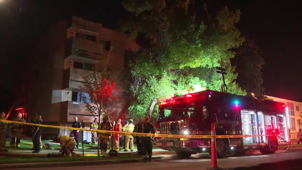 Fire crews and police tend to a fire in north Edmonton Friday, Sept. 1, 2023.