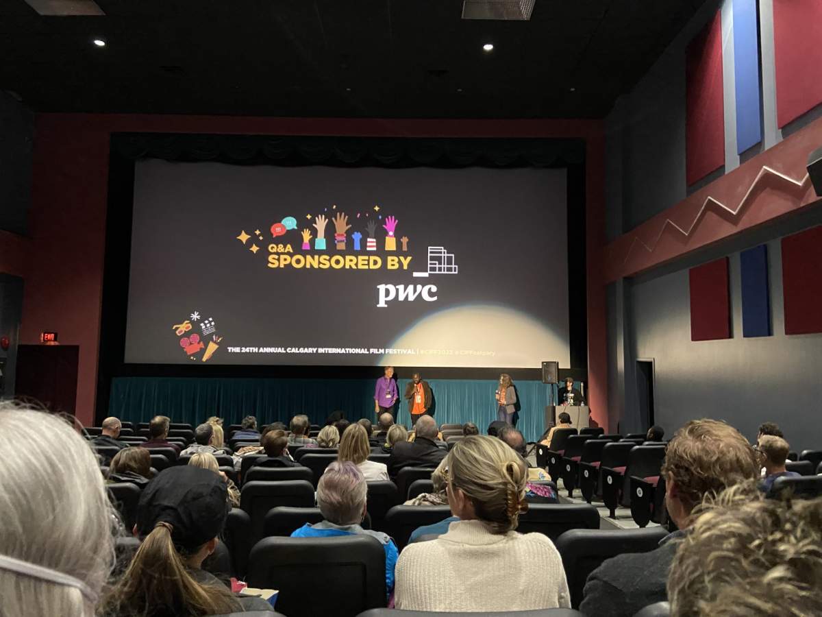 Calgary based filmmaker Sylvester Ndumbi’ answers questions from the audience after the screening of his climate change documentary Without Leaving Anyone Behind.