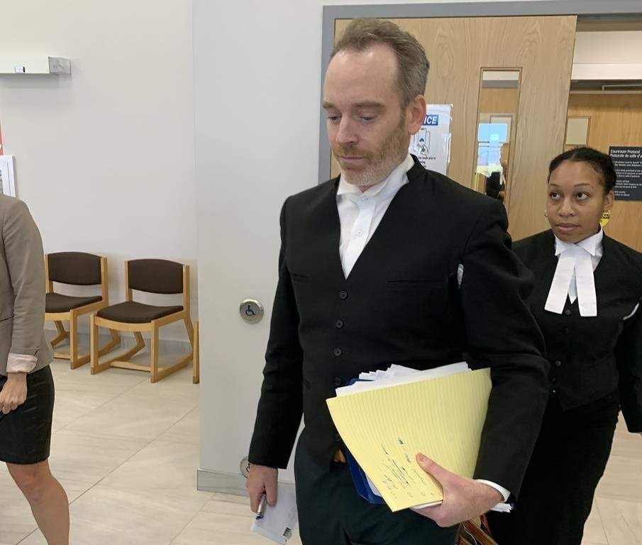 Justice Joshua Arnold is providing a jury with instruction today in the retrial of a man accused of murdering a pizza delivery worker in a Halifax suburb 13 years ago. Defence lawyer Trevor McGuigan is shown at the Nova Scotia Supreme Court, in Dartmouth, N.S., Tuesday, Oct. 3, 2023. THE CANADIAN PRESS/Michael Tutton.