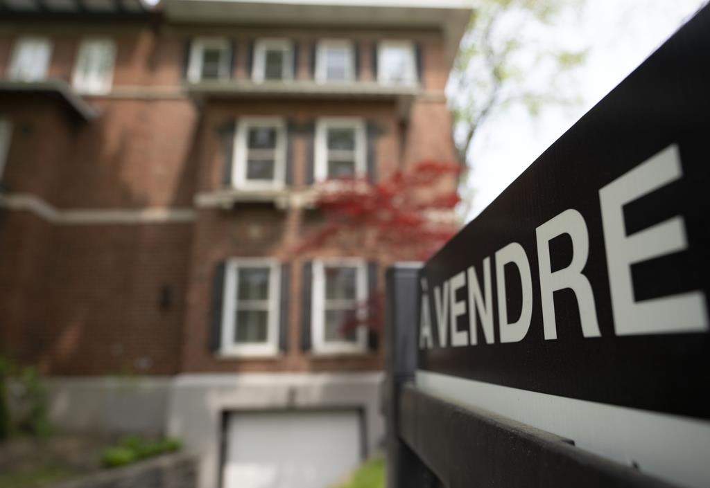 The Quebec Professional Association of Real Estate Brokers says Montreal home sales in September rose nine per cent compared with a year ago, but remained below the historic average for the time of year. Real estate signage showing a home for sale is seen on Monday, May 15, 2023 in Montreal. 