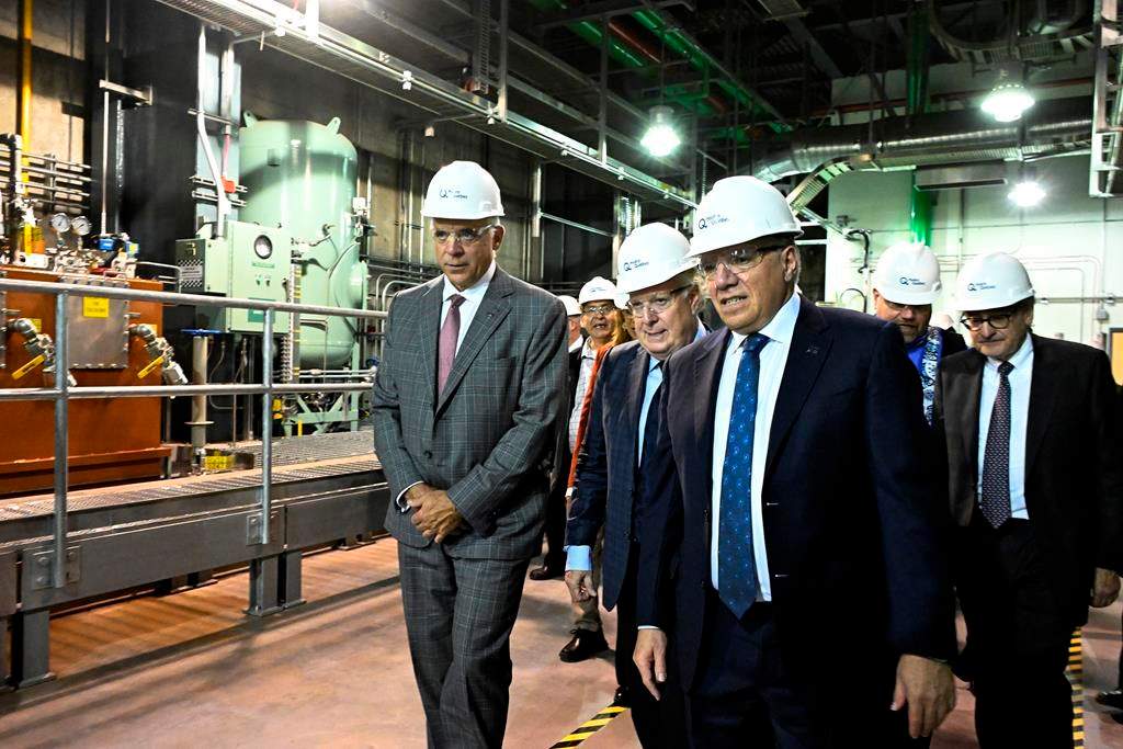 Quebec Economy and Innovation Minister Pierre Fitzgibbon, (left to right), former Quebec premier Jean Charest, Quebec Premier Francois Legault and Hydro Quebec president Michael Sabia visit the La Romaine hydroelectric plant, Thursday, October 12, 2023, in Havre Saint-Pierre, Que. Jean Charest's son is responding after Quebec Premier François Legault suggested it's an insult to be compared to the former federalist premier. THE CANADIAN PRESS/Jacques Boissinot.